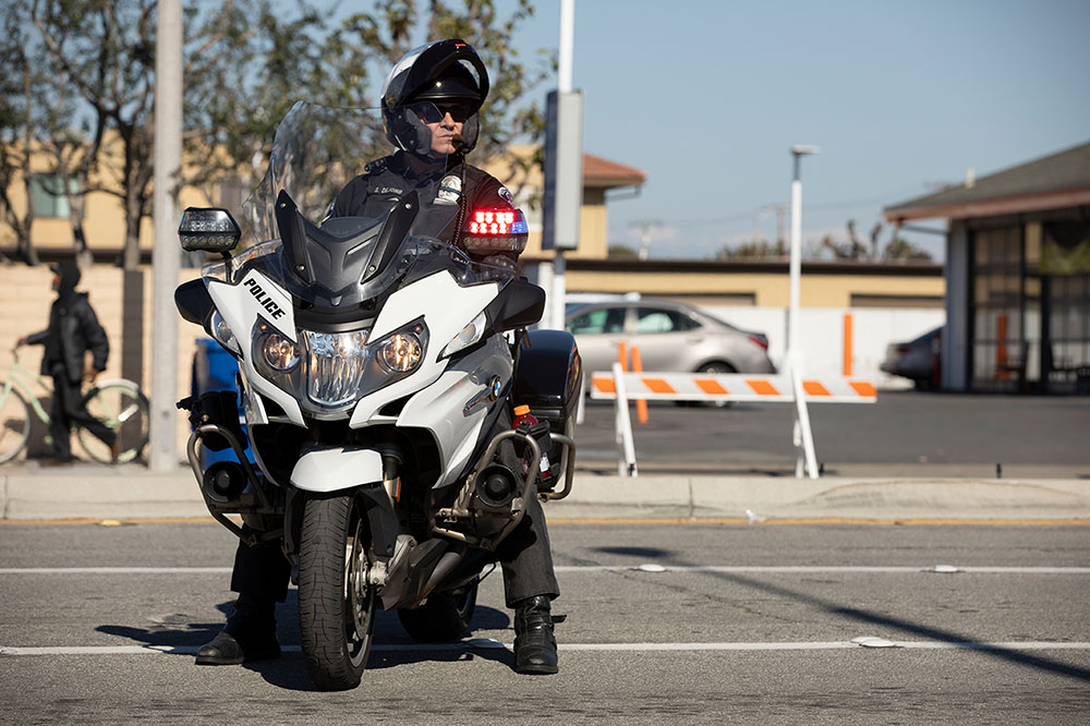 Police officer seated on a patrol motorcycle