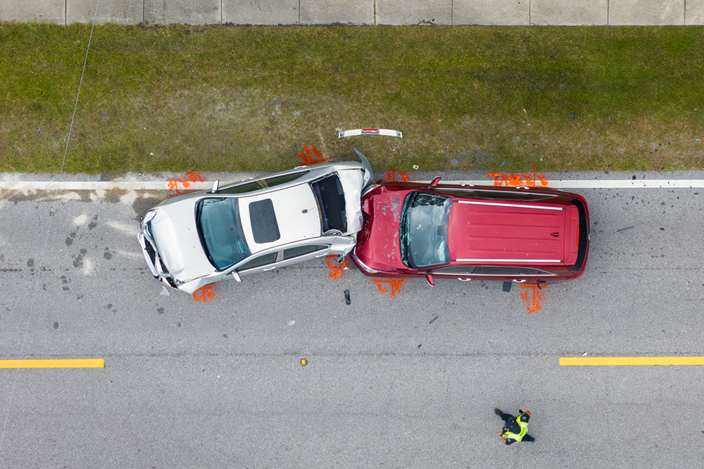 Aerial view of a two-vehicle collision on a roadway