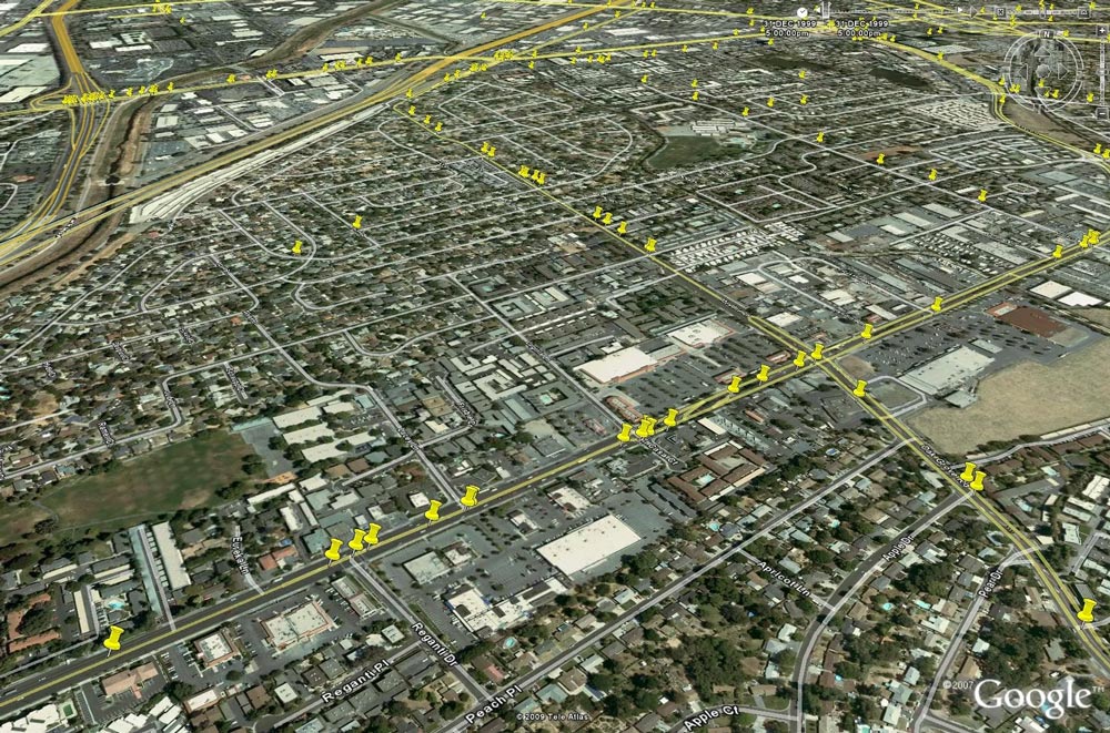 Aerial map with yellow location markers along streets